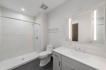 Bathroom with quartz countertops and surrounds*